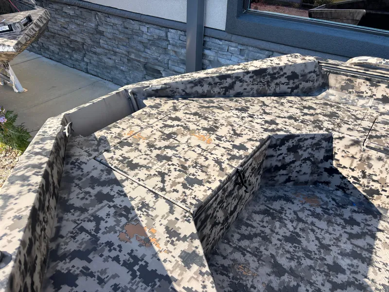 Slide: The Image of 2025 Edge Duck Boats 756DB with camouflage pattern, outdoor display. - 18