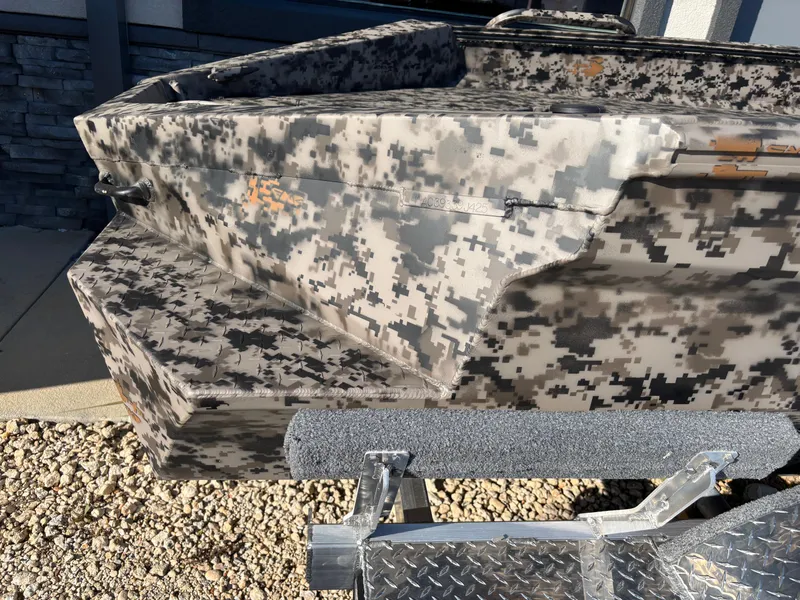 Slide: The Image of 2025 Edge Duck Boats 756DB with camouflage design on a trailer. - 25