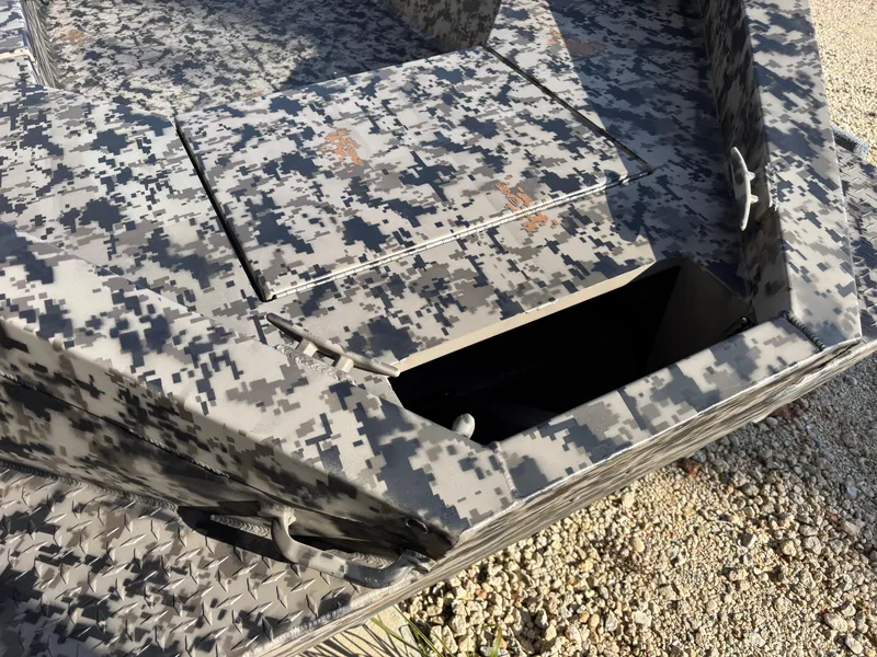 Slide: The Image of 2025 Edge Duck Boats 756DB with digital camouflage design and storage compartment. - 3