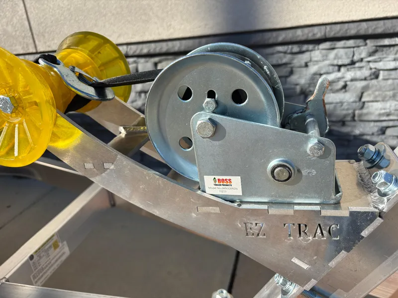 Slide: The Image of Close-up of EZ Trac winch system on 2025 Edge Duck Boats 756DB trailer. - 36