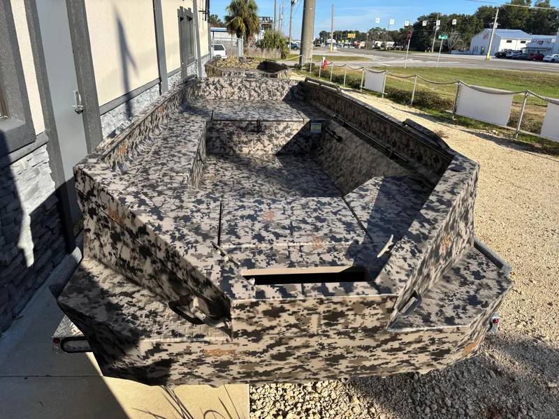 Slide: The Image of 2025 Edge Duck Boats 756DB with camouflage design, displayed outdoors. - 2