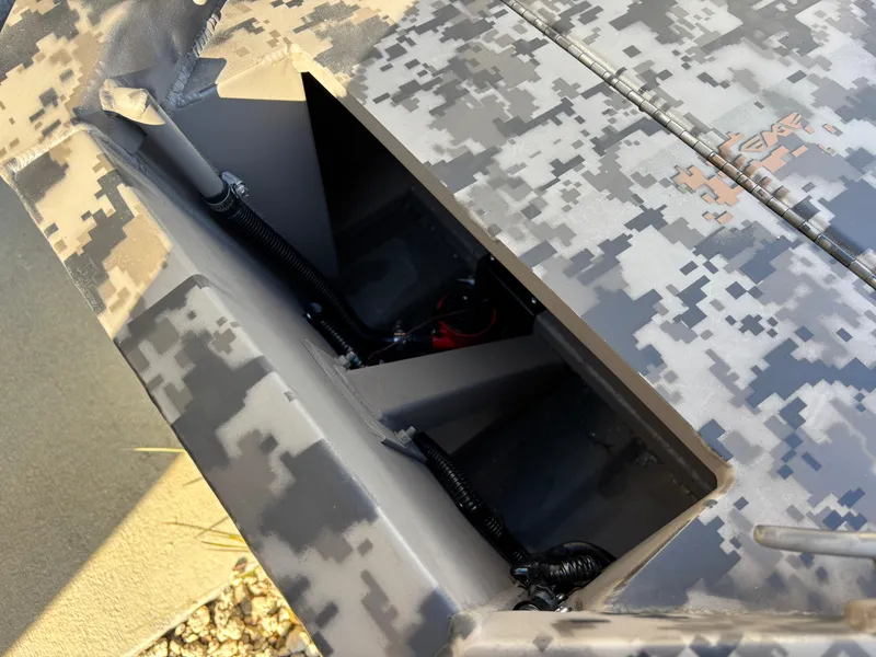 Slide: The Image of 2025 Edge Duck Boats 756DB with digital camouflage pattern and open storage compartment. - 22