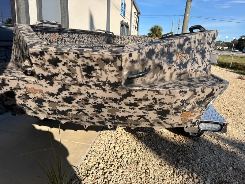 Slide: The Image of 2025 Edge Duck Boats 756DB with camouflage design on a gravel surface. - 26