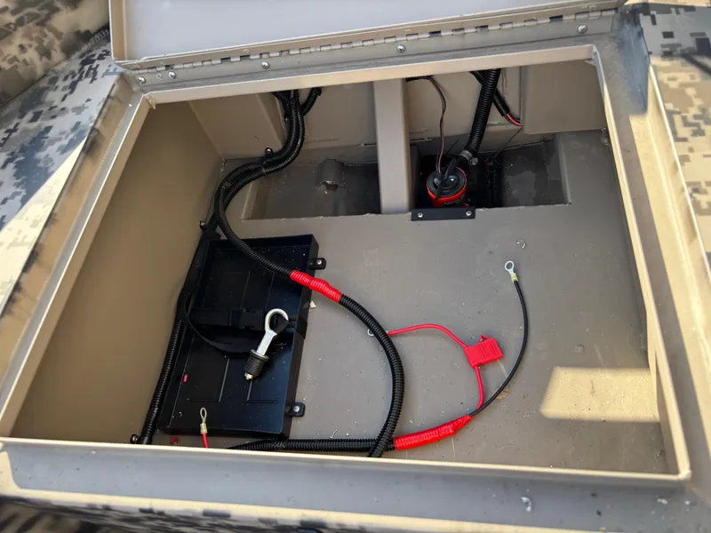 Slide: The Image of 2025 Edge Duck Boats 756DB battery compartment with wiring and connections. - 4
