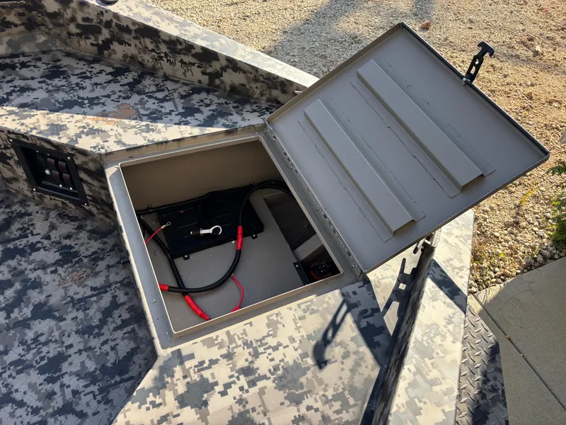 Slide: The Image of Open storage compartment in 2025 Edge Duck Boats 756DB with camouflage design. - 5