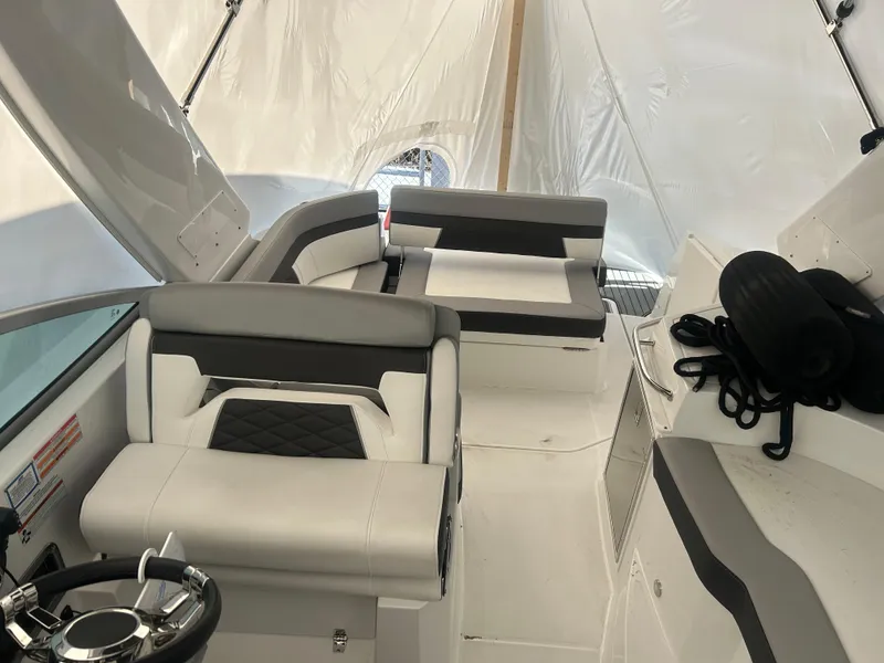 Slide: The Image of 2022 Monterey 295 Sport Yacht interior with sleek seating and modern design. - 10