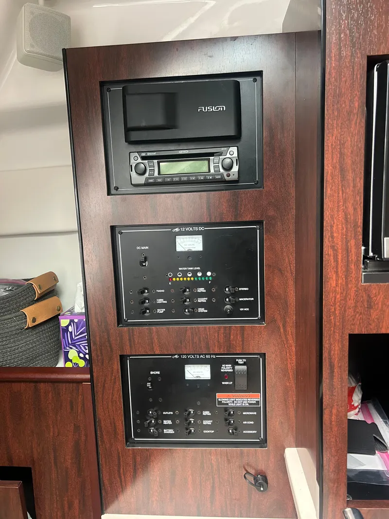 Slide: The Image of Control panel and stereo system in 2022 Monterey 295 Sport Yacht interior. - 17