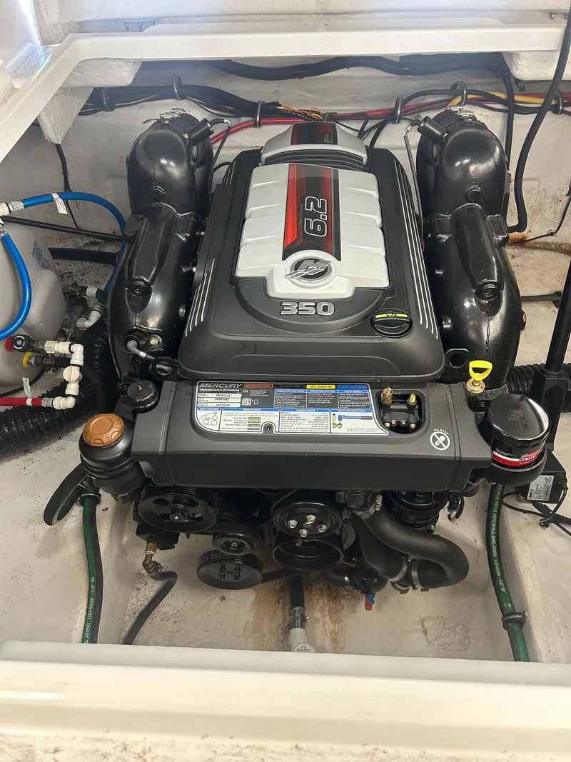 Slide: The Image of Engine compartment of a 2022 Monterey 295 Sport Yacht, featuring a 6.2L 350 horsepower engine. - 20
