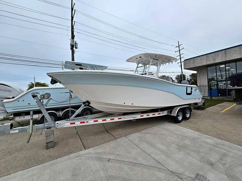 The Image of 2023 Sea Fox 268 Commander boat on trailer, parked outdoors. - 1