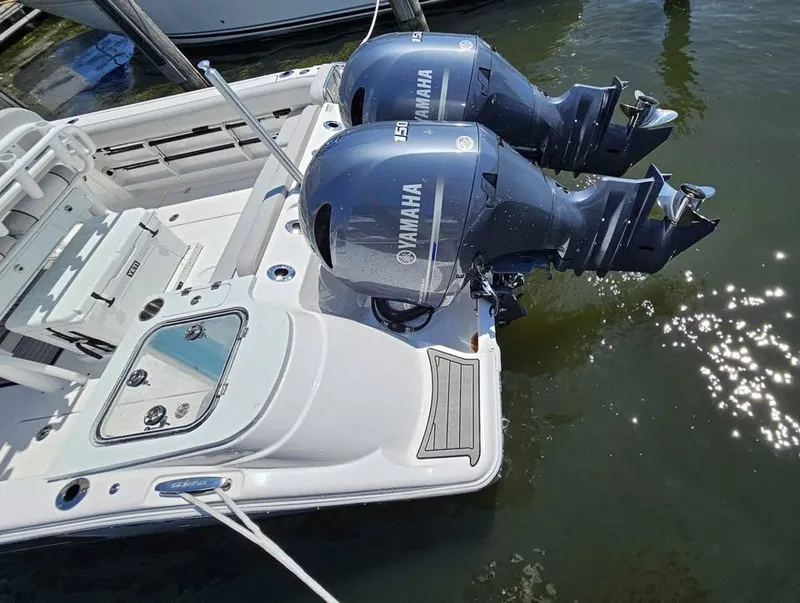 Slide: The Image of 2023 Sea Fox 268 Commander with dual Yamaha outboard engines in water. - 12