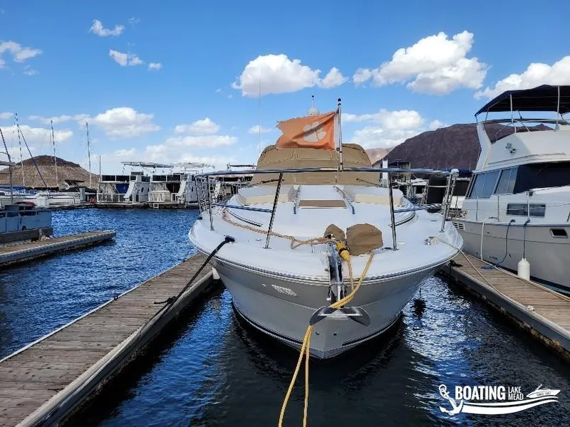 Slide: The Image of 2003 Sea Ray 380 Sundancer docked at marina under blue sky. - 12