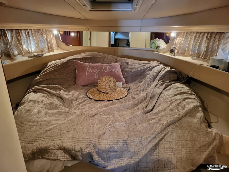 Slide: The Image of Cozy cabin interior of 2003 Sea Ray 380 Sundancer with bed and decorative pillow. - 20