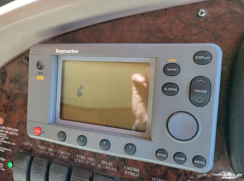 Slide: The Image of Raymarine GPS display on 2003 Sea Ray 380 Sundancer boat dashboard. - 24