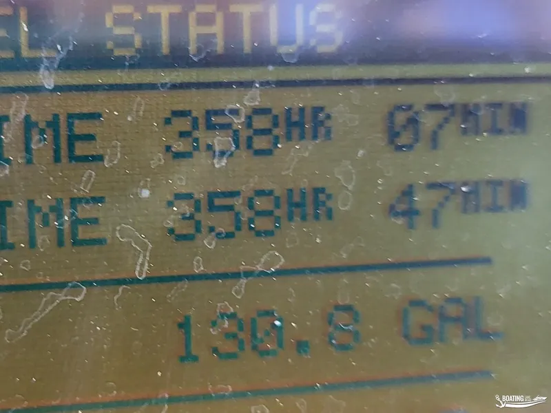 Slide: The Image of Close-up of a Sea Ray 380 Sundancer 2003 display showing engine hours and fuel status. - 25