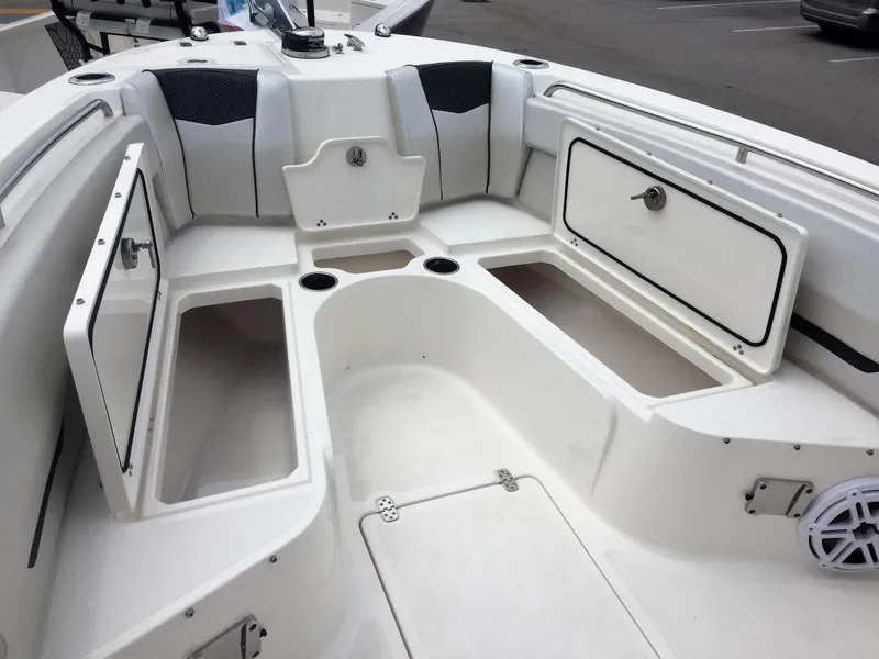 Slide: The Image of 2019 Wellcraft 242 Fisherman boat interior with open storage compartments. - 26