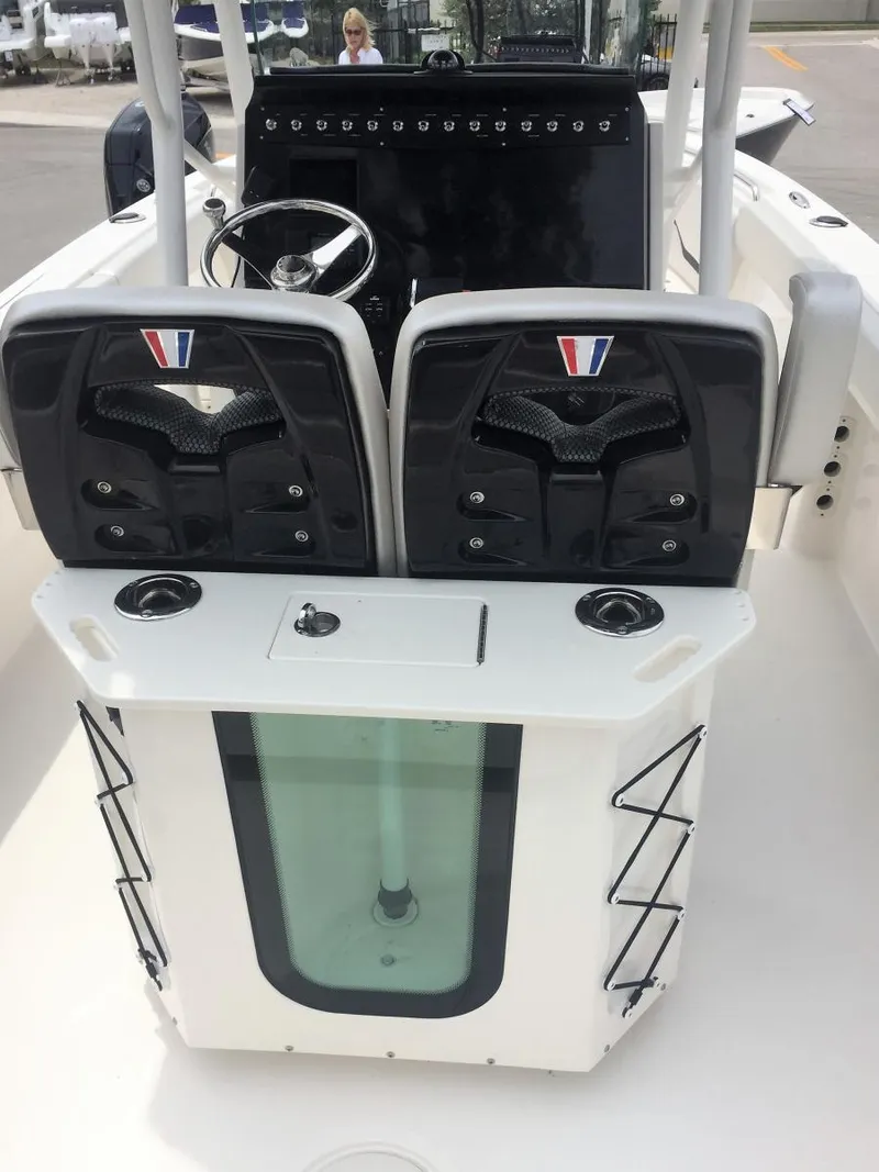 Slide: The Image of 2019 Wellcraft 242 Fisherman boat interior with dual seats and steering console. - 27