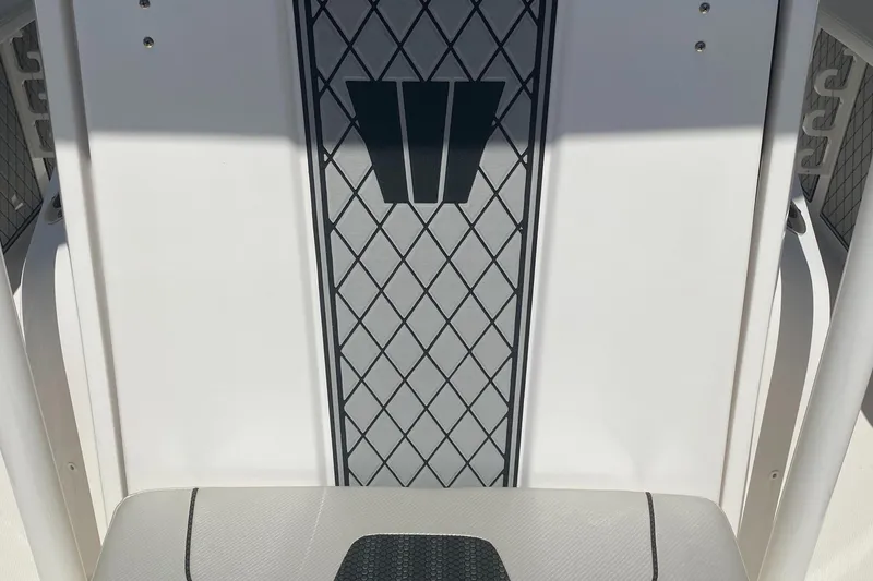 Slide: The Image of 2019 Wellcraft 242 Fisherman boat interior with diamond-patterned design. - 28