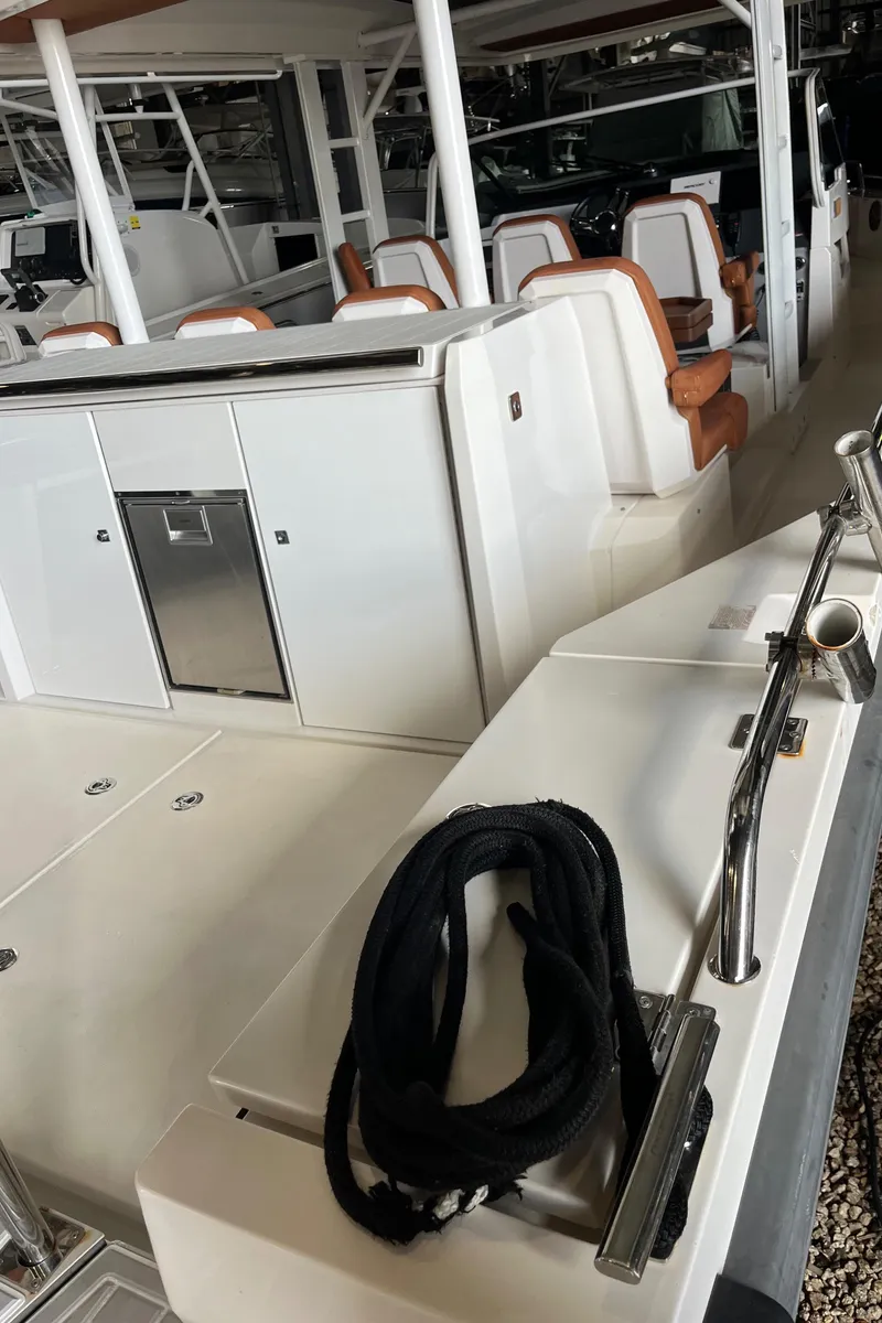 Slide: The Image of 2018 Axopar 370 SUN TOP deck details includes icemaker - 12