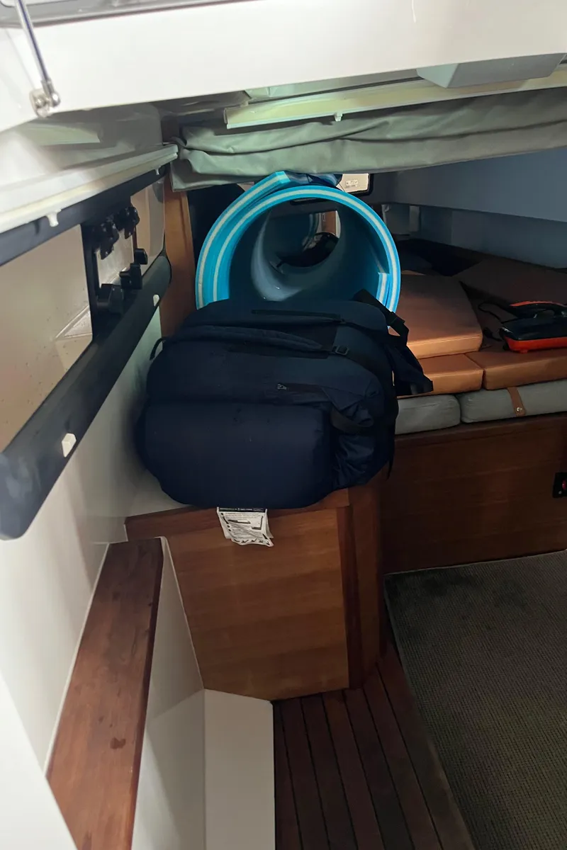 Slide: The Image of Interior cabin of 2018 Axopar 370 SUN TOP with bags and rolled-up floating mat. - 14