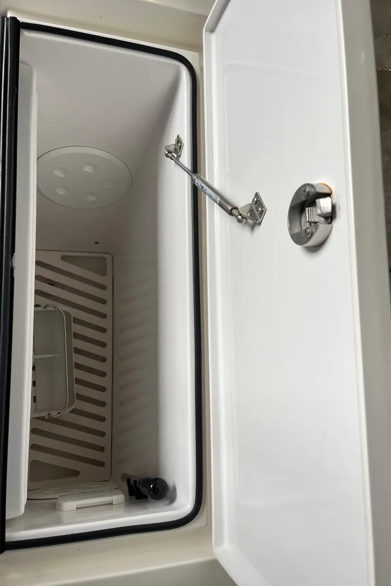 Slide: The Image of Open storage compartment on 2018 Axopar 370 SUN TOP boat. - 15