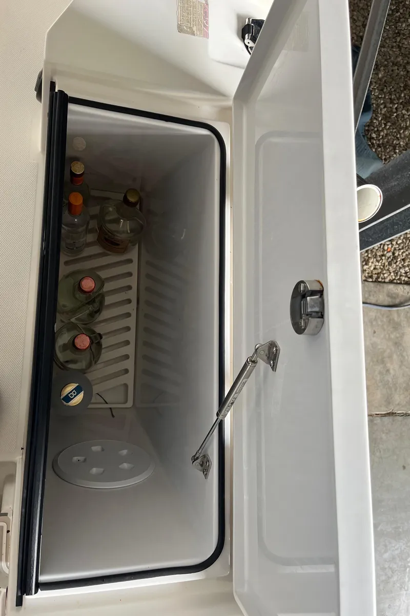 Slide: The Image of Open cooler with drinks inside on 2018 Axopar 370 SUN TOP boat. - 19