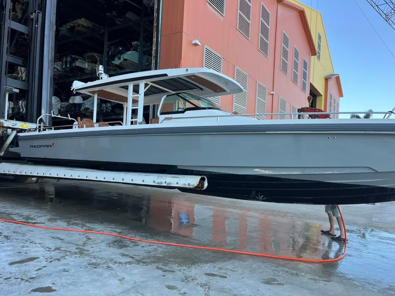 Slide: The Image of 2018 Axopar 370 SUN TOP boat in dry storage marina, side view. - 5