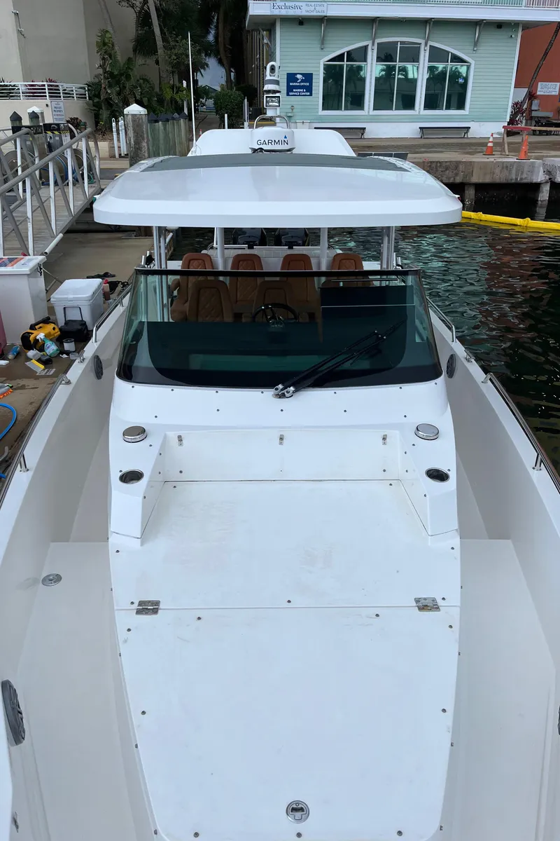 Slide: The Image of 2018 Axopar 370 SUN TOP boat docked at marina. - 9