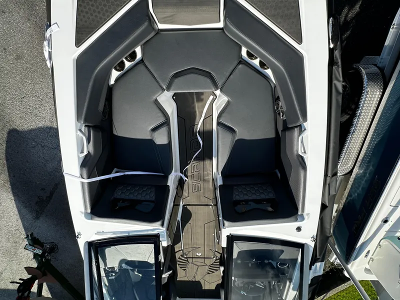 Slide: The Image of 2024 Scarab 235 Wake ID boat interior, featuring sleek seating and modern design elements. - 14