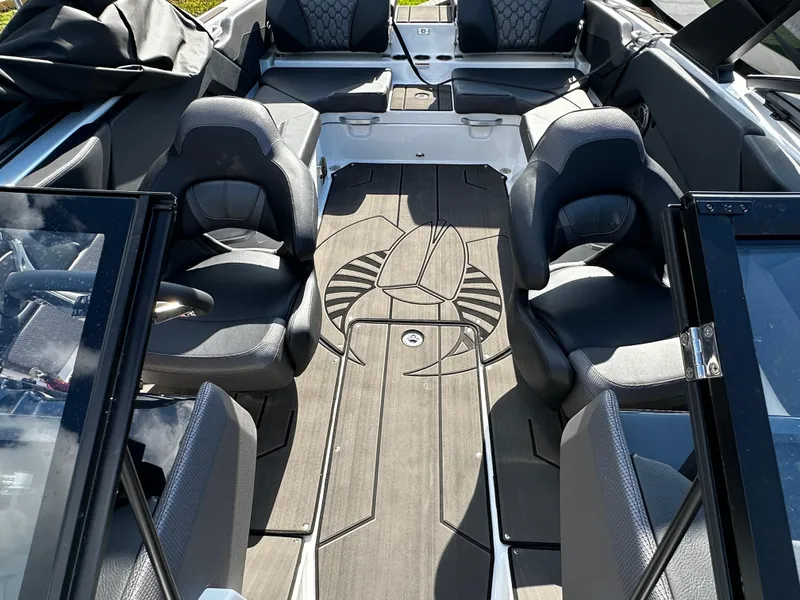 Slide: The Image of 2024 Scarab 235 Wake ID boat interior with stylish seating and sleek design. - 20