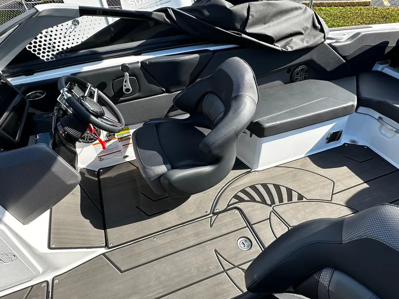 Slide: The Image of 2024 Scarab 235 Wake ID boat interior with sleek seating and modern dashboard design. - 22