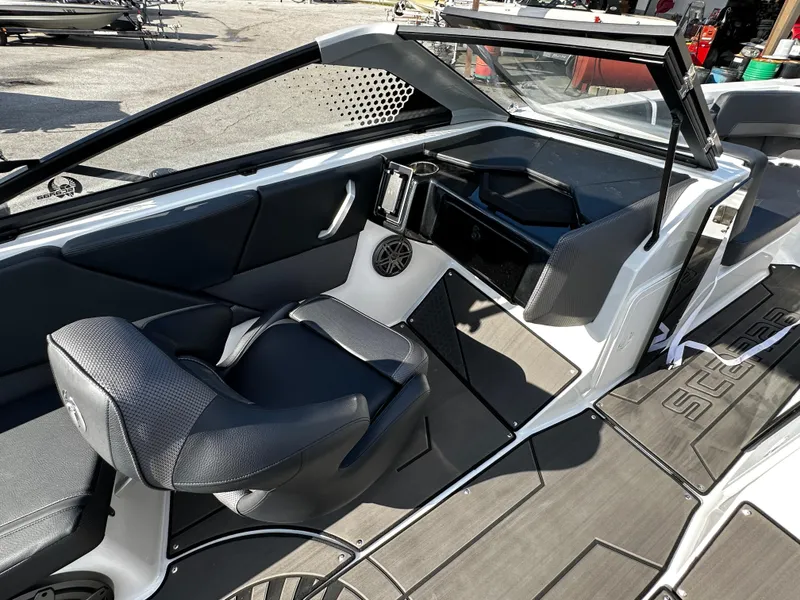 Slide: The Image of 2024 Scarab 235 Wake ID boat interior with sleek seating and modern dashboard. - 25