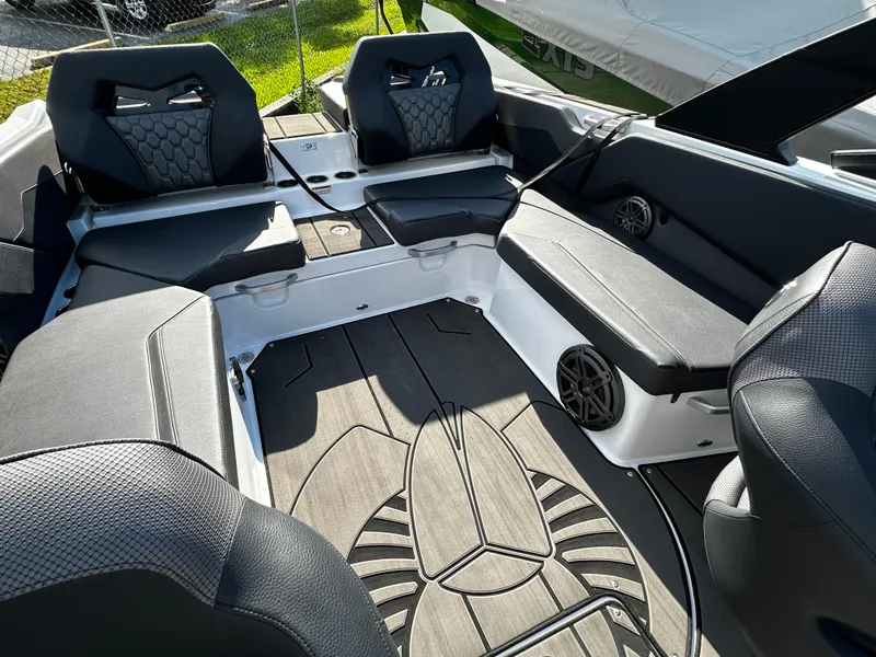 Slide: The Image of 2024 Scarab 235 Wake ID boat interior with stylish seating and modern design. - 26