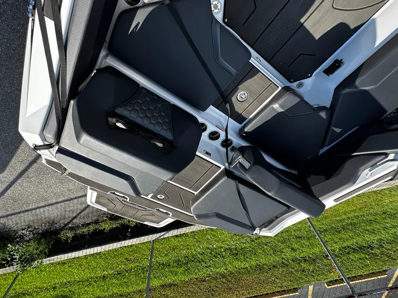 Slide: The Image of 2024 Scarab 235 Wake ID boat interior with sleek black and gray seating design. - 29