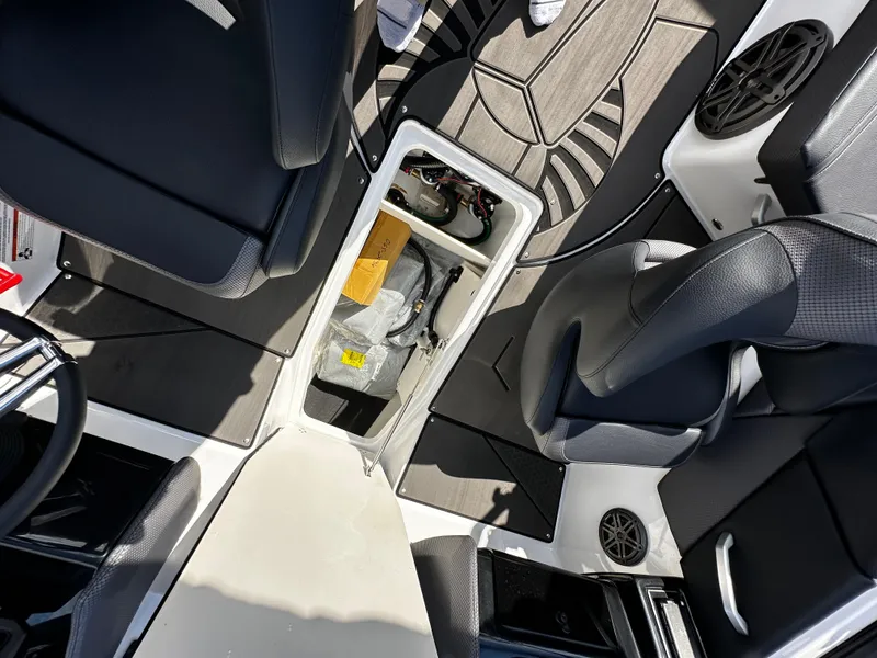 Slide: The Image of 2024 Scarab 235 Wake ID interior with storage compartment and seating. - 33