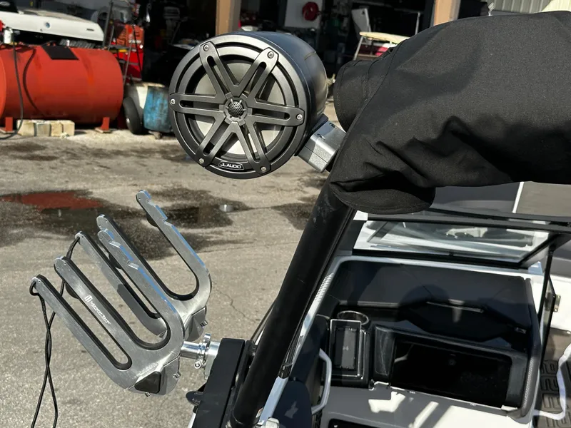 Slide: The Image of 2024 Scarab 235 Wake ID boat with speaker and wakeboard rack detail. - 35