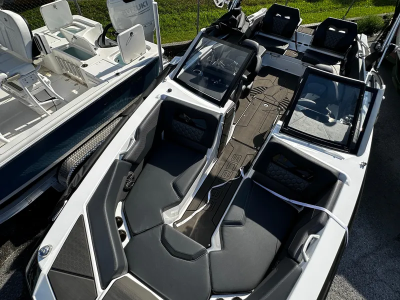 Slide: The Image of 2024 Scarab 235 Wake ID boat with sleek interior design and modern seating arrangement. - 36
