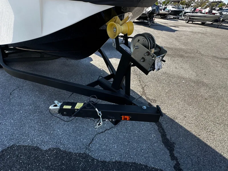 Slide: The Image of Trailer hitch of 2024 Scarab 235 Wake ID boat in parking lot. - 4