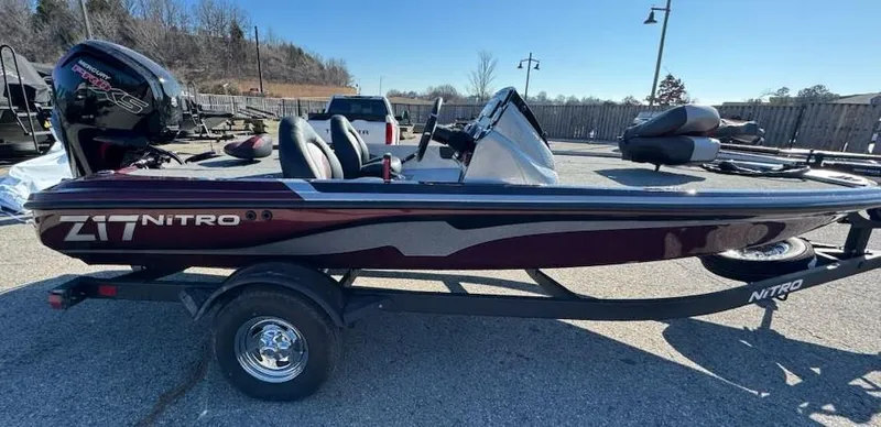 The Image of 2025 Nitro Z17 boat on trailer, parked outdoors, side view. - 0
