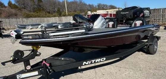 Slide: The Image of 2025 Nitro Z17 boat on trailer, parked outdoors, with clear sky background. - 1