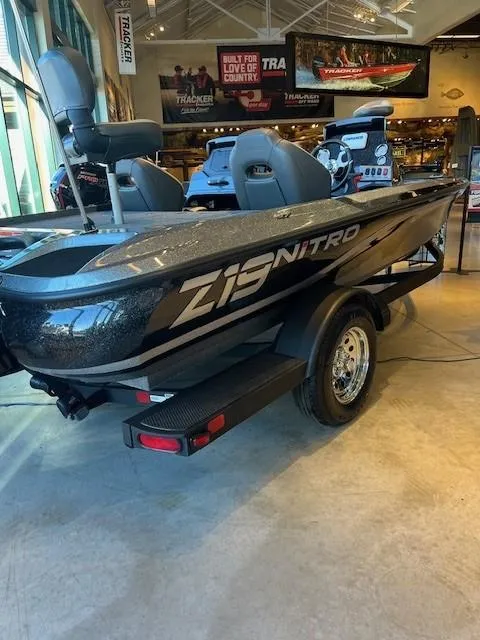 Slide: The Image of 2025 Nitro Z19 boat with powerful engine, parked outdoors on a sunny day. - 1