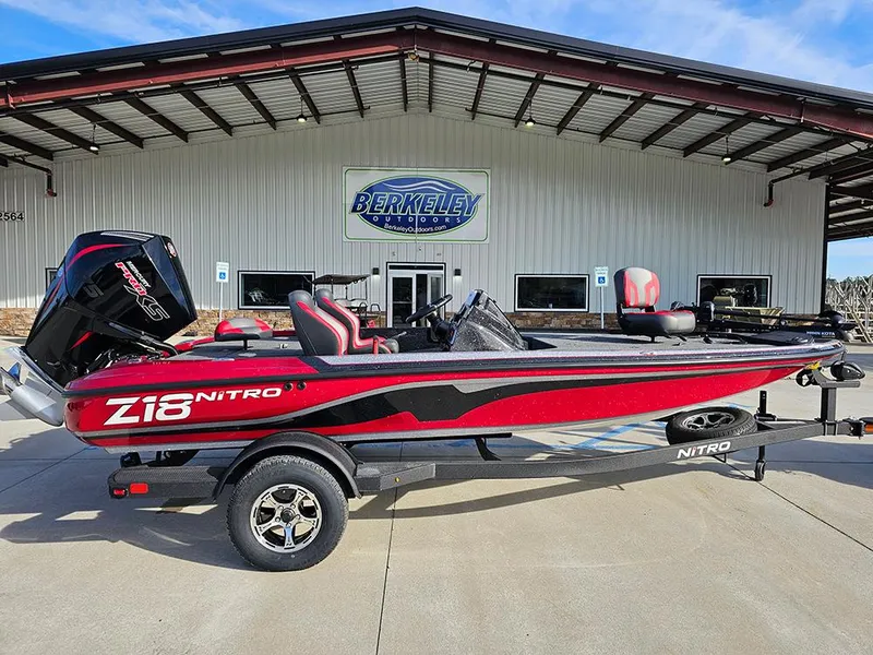 The Image of 2025 Nitro Z18 boat in red and black, parked outside Berkeley Outdoors. - 1