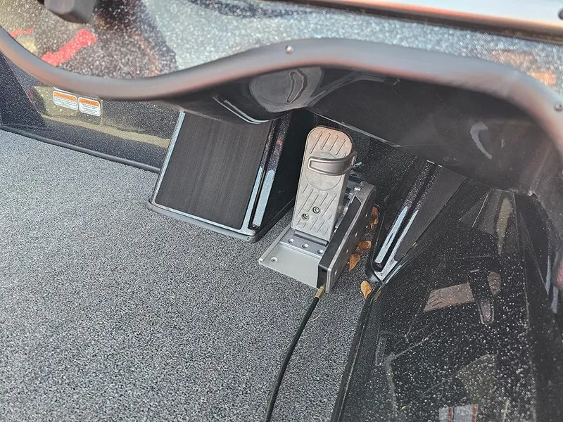 Slide: The Image of 2025 Nitro Z18 boat foot pedal and control panel in cockpit area. - 13