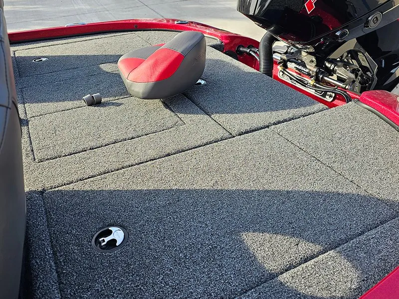 Slide: The Image of 2025 Nitro Z18 boat deck with gray carpet and red seat. - 17