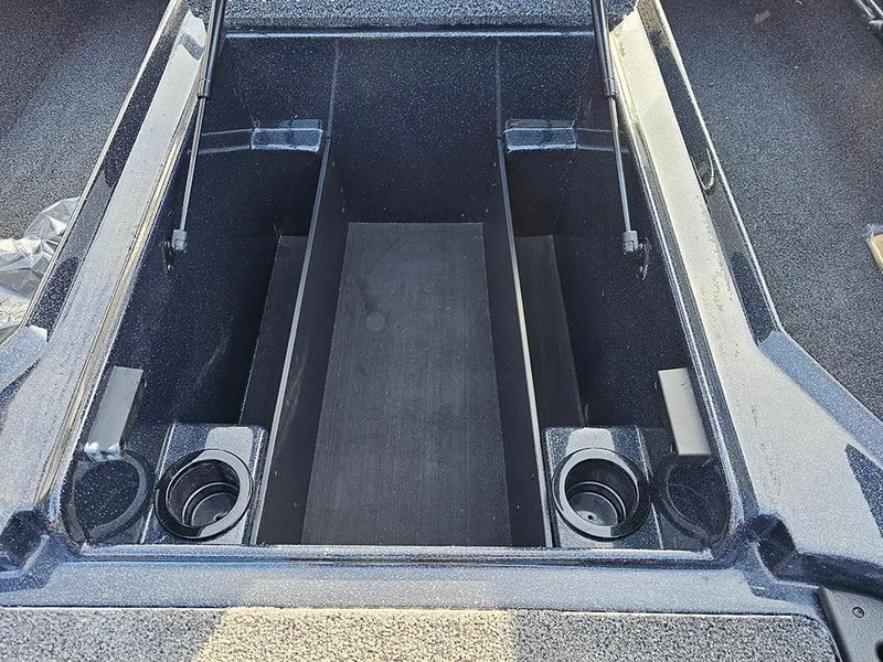 Slide: The Image of 2025 Nitro Z18 boat storage compartment with cup holders and sleek design. - 24