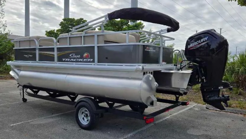 Slide: The Image of 2025 Sun Tracker Party Barge 18 DLX pontoon boat with Mercury outboard motor. - 11