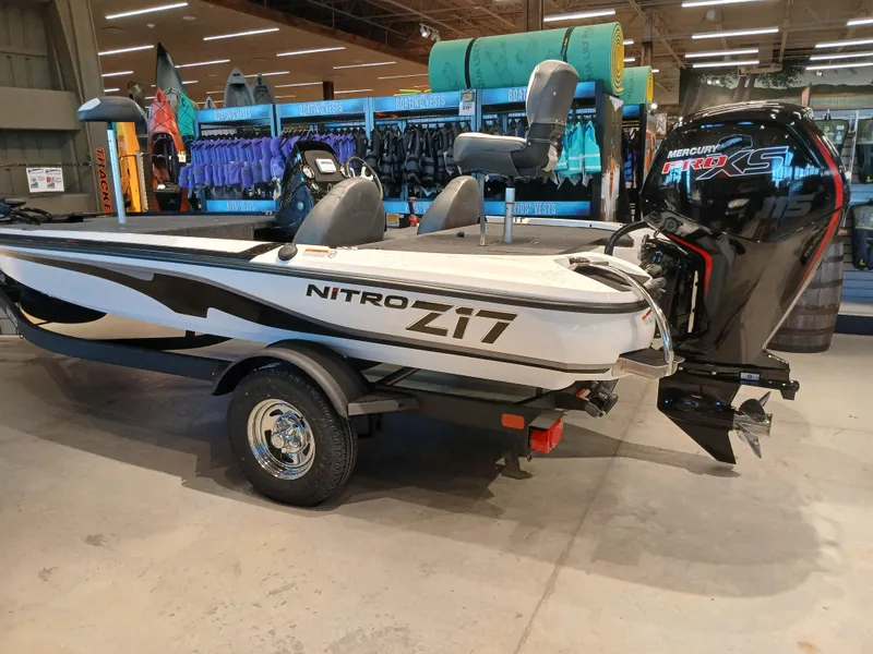Slide: The Image of 2025 Nitro Z17 boat with Mercury engine displayed indoors. - 2