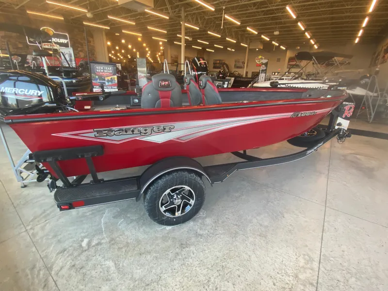 The Image of 2025 Ranger VS1665T boat in showroom, red exterior, on trailer. - 0