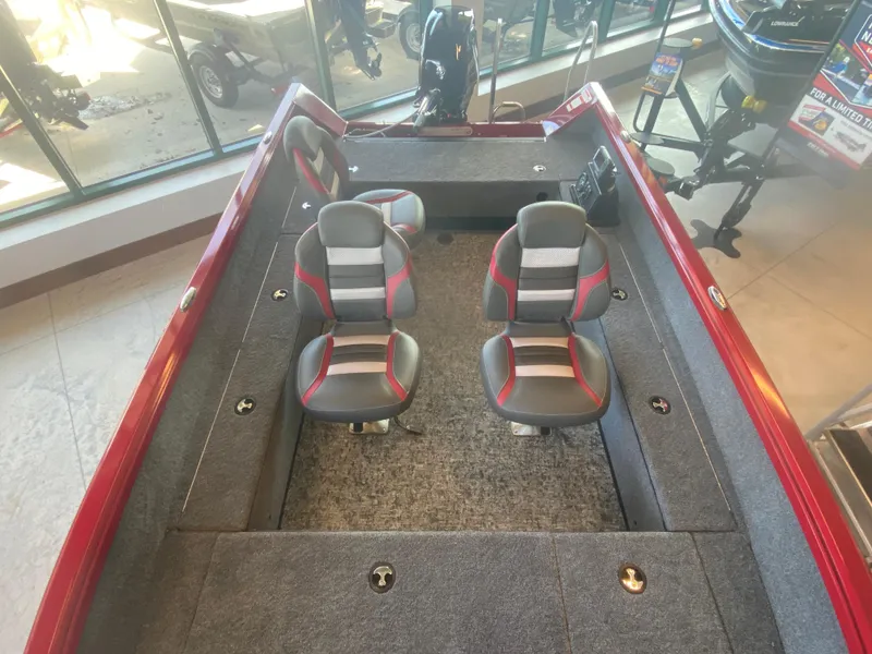 Slide: The Image of 2025 Ranger VS1665T boat interior with dual seats and red accents. - 5