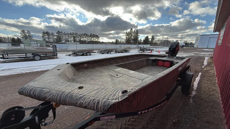 Slide: The Image of 2025 Tracker Grizzly 1650 T Prairie Wings Edition boat on trailer, outdoor setting. - 4