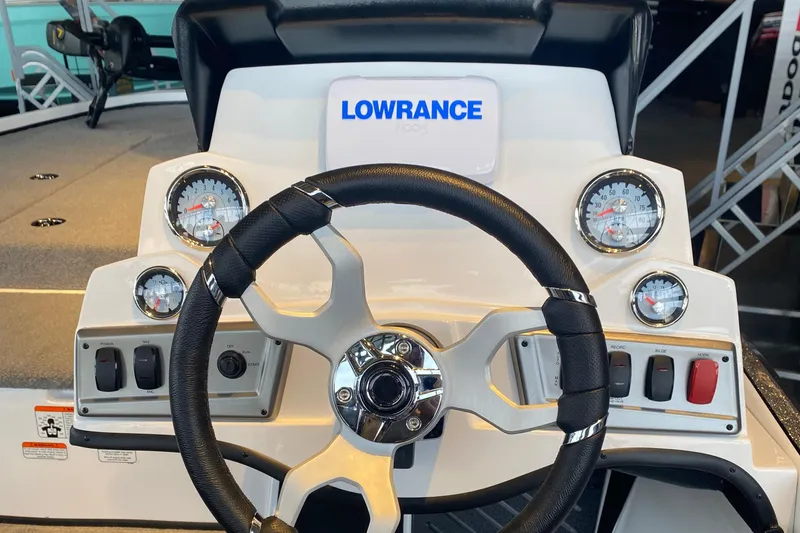 Slide: The Image of Steering console of 2025 Nitro Z18 boat with gauges and Lowrance display. - 3